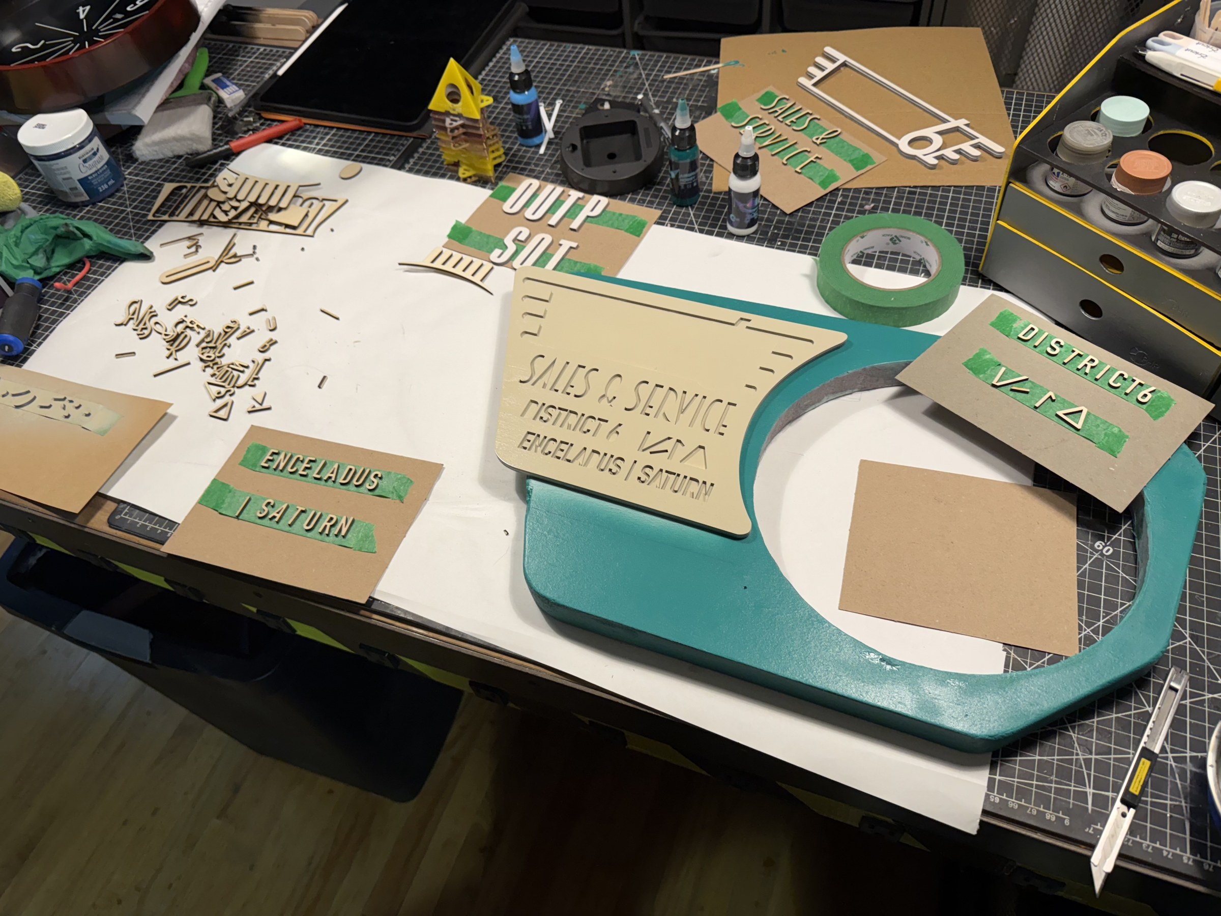 Outpost Clock housing and sign during painting and masking