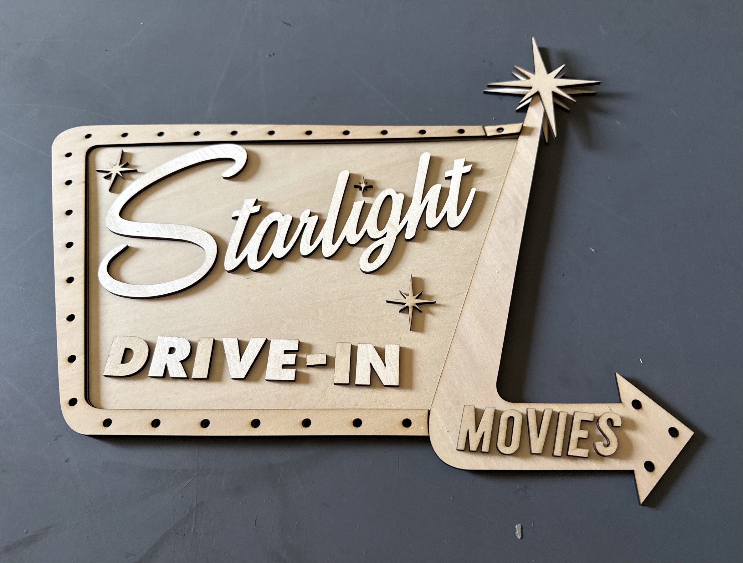 Starlight sign with unpainted cut parts and raised lettering